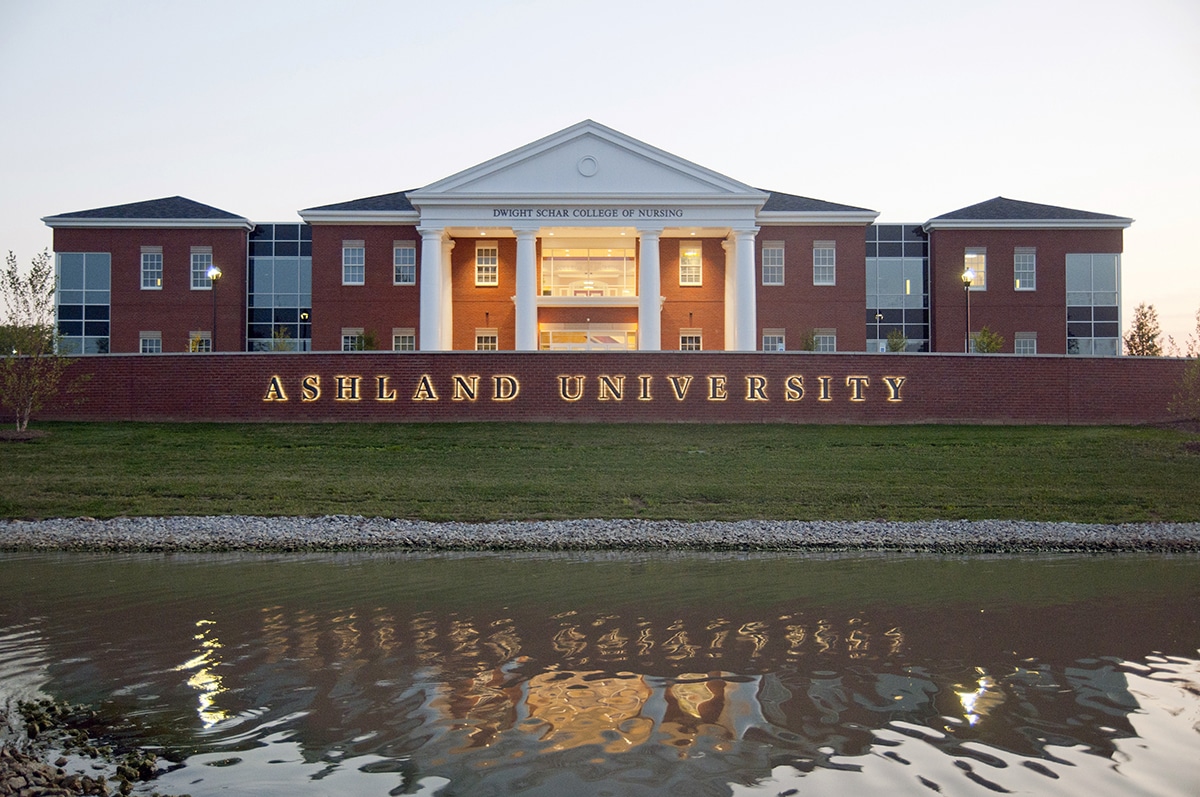Ashland University illuminated sign in front of multistory brick building