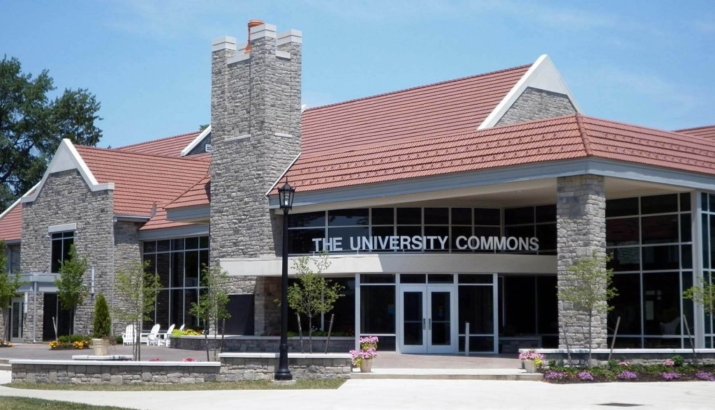 Heidelberg University commons stone brick building with large glass walls