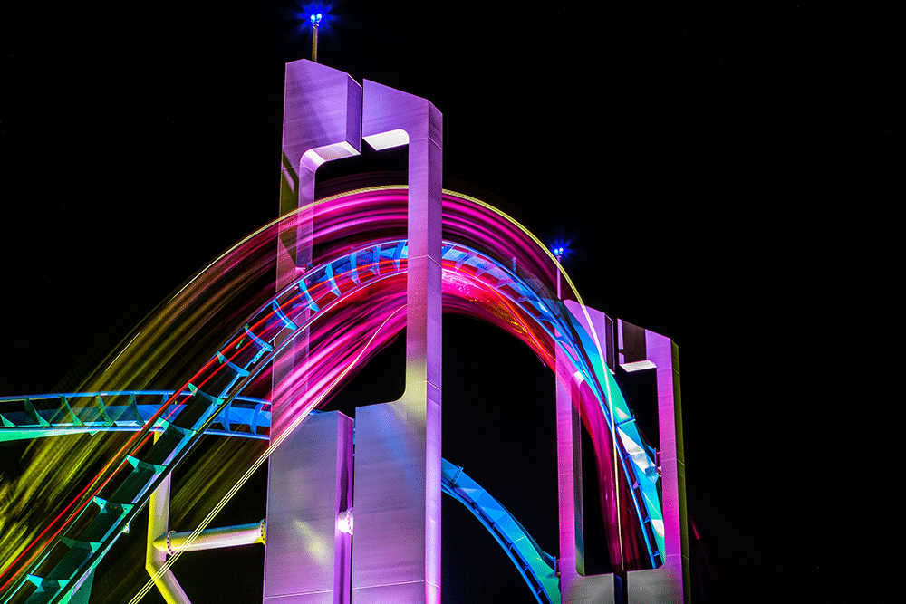 Long exposure image of roller. coaster hill at night