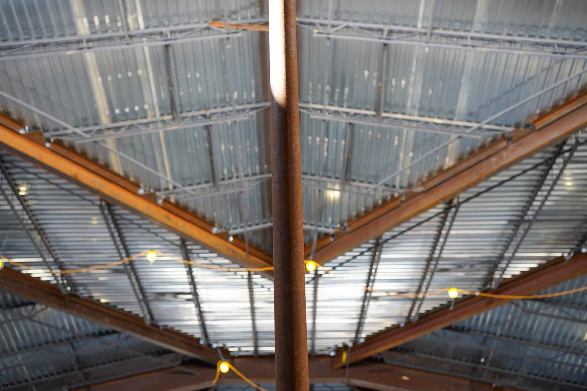 Metal beams and tin roof of building