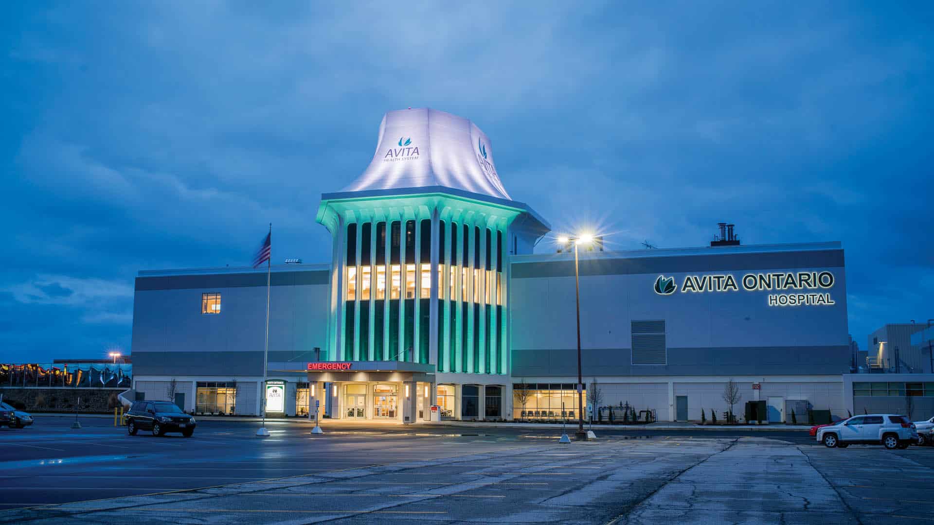 Exterior of emergency entrance to Avita Ontario Hospital at night
