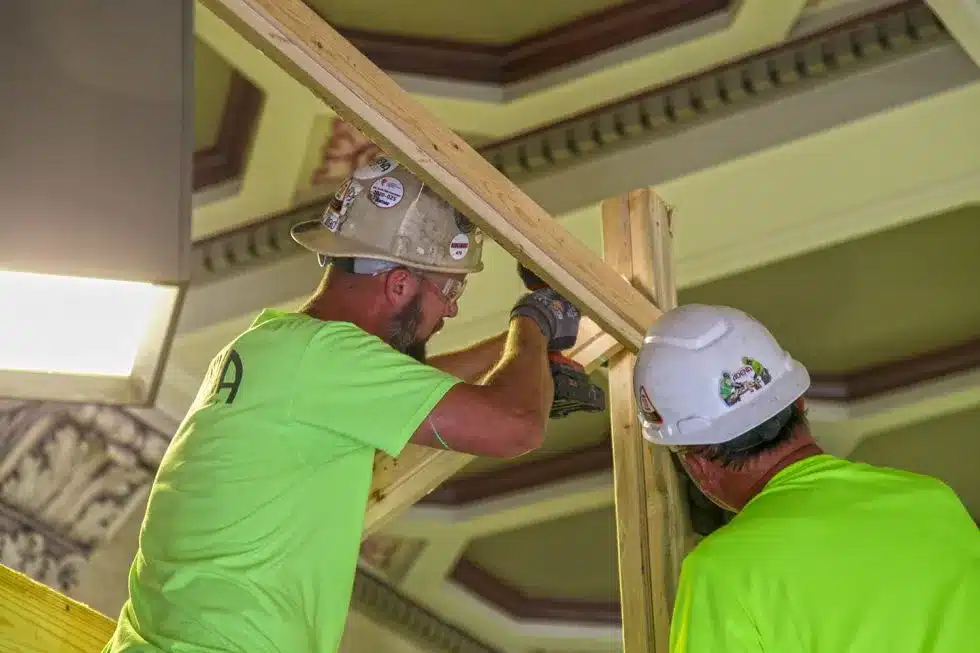Two men drilling wood together